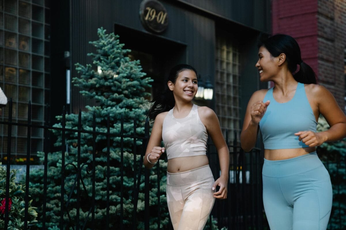Two Girls enjoying themselves while jogging
